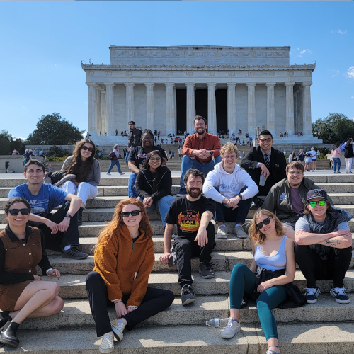 Debate team on the steps of the Lincoln Memorial. 